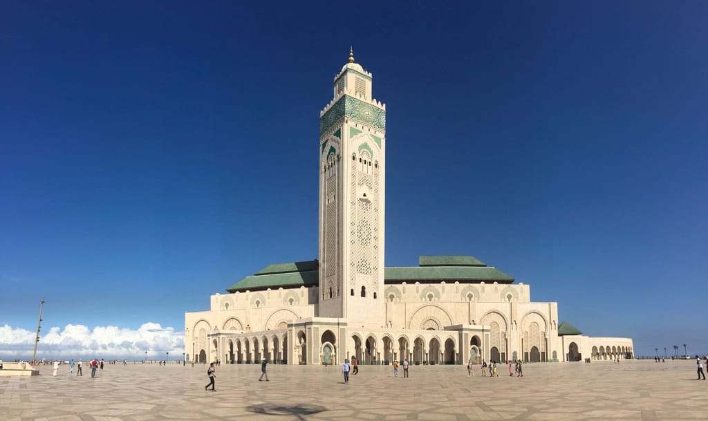 The Hassan II Mosque in Casablanca under a blue sky