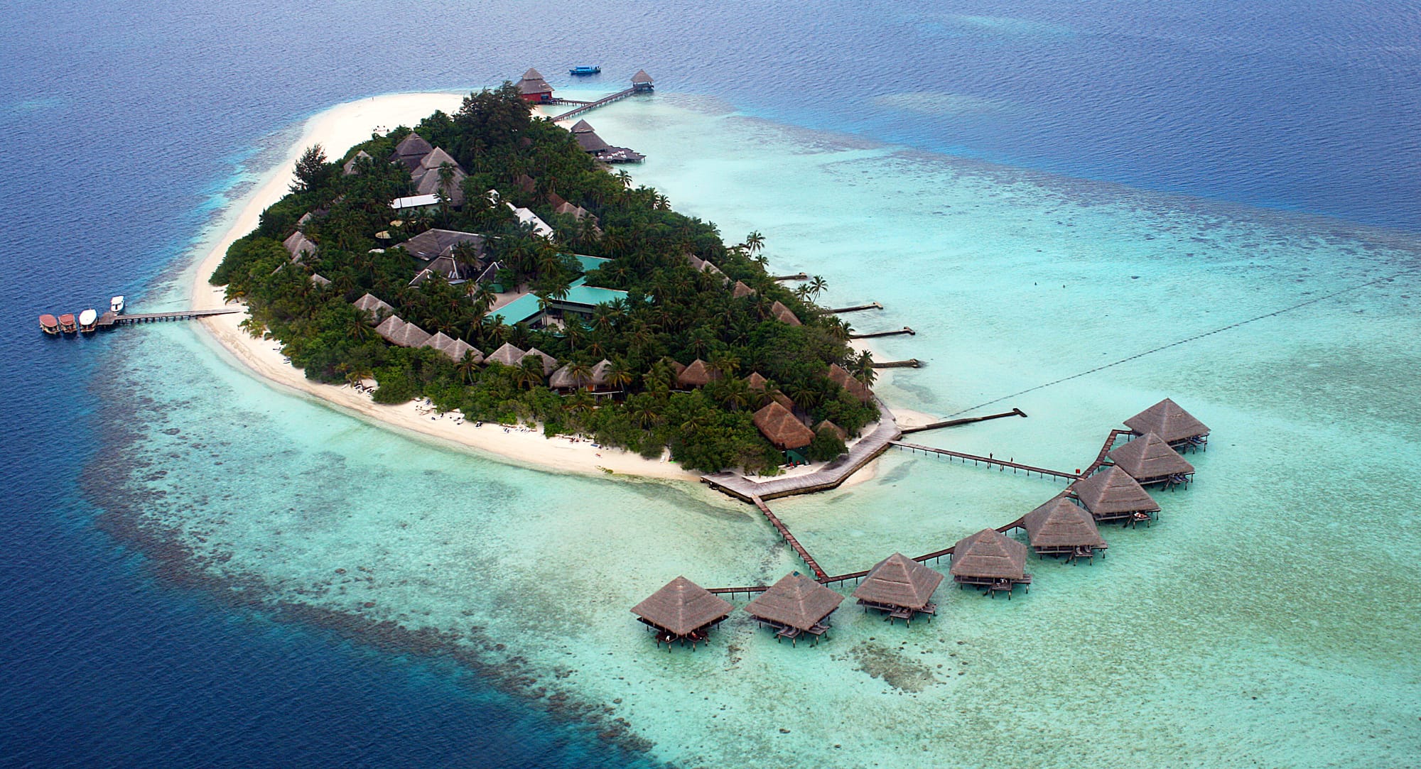 A Maldives resort island with overwater villas
